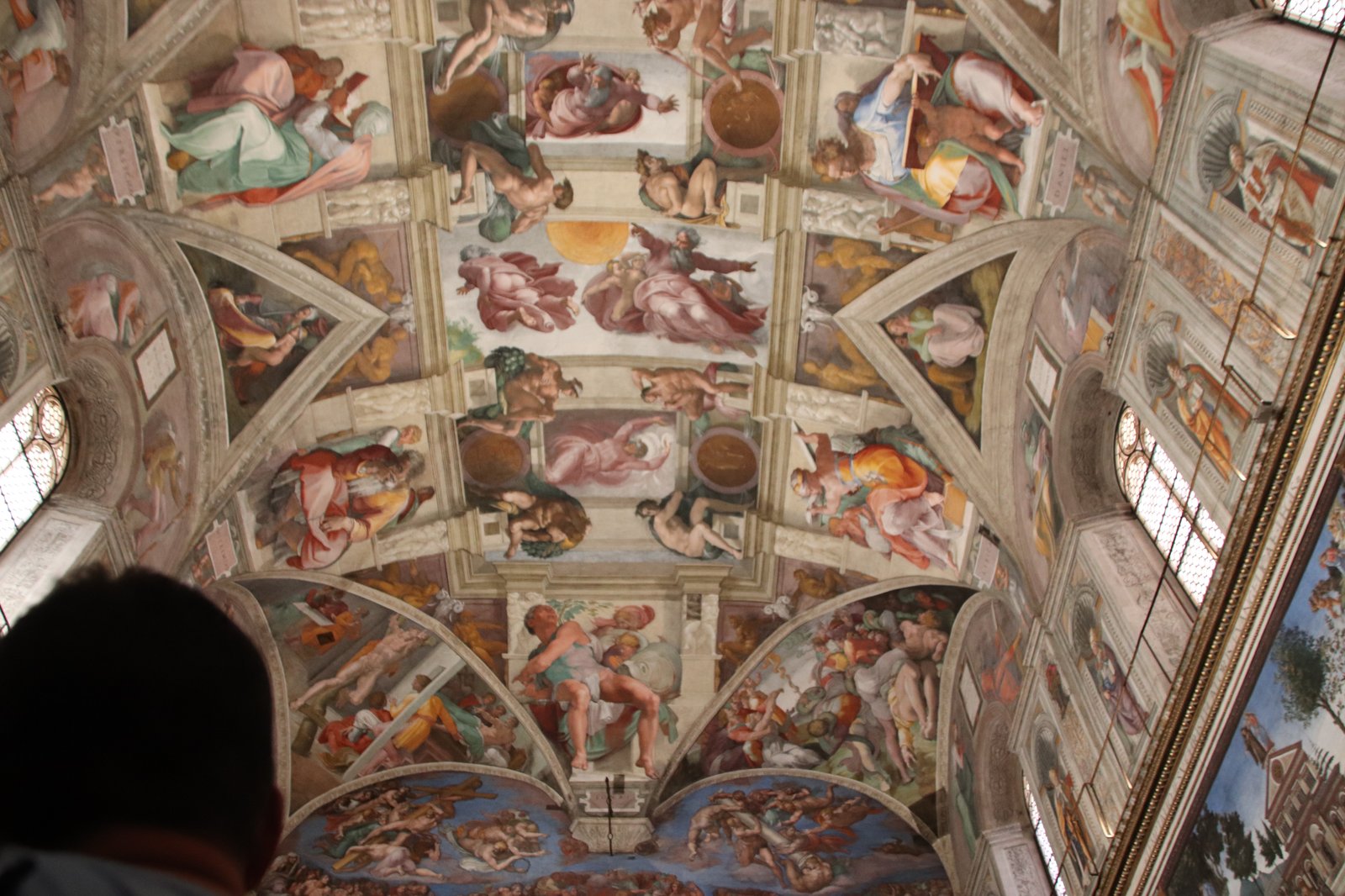 The Sistine Chapel ceiling by Michelangelo, where the Vatican dress code is strictly enforced at the door